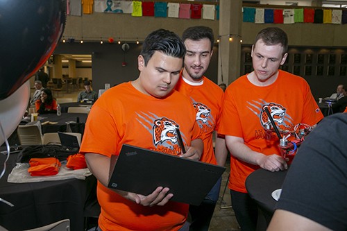 People looking at laptop